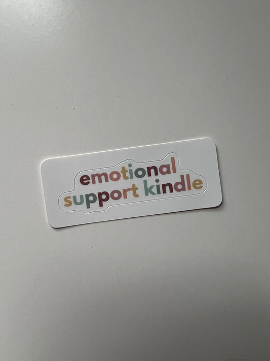 White sticker that is cut out around the words “emotional support sticker”. The letters are in a varying shade of pastel rainbow colors.